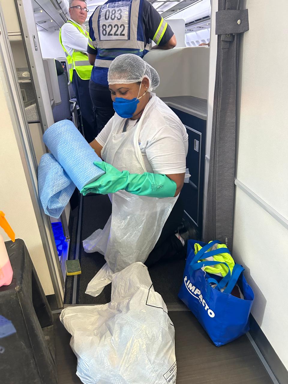 Impacto Aviation technician preparing cleaning supplies in the cabin
