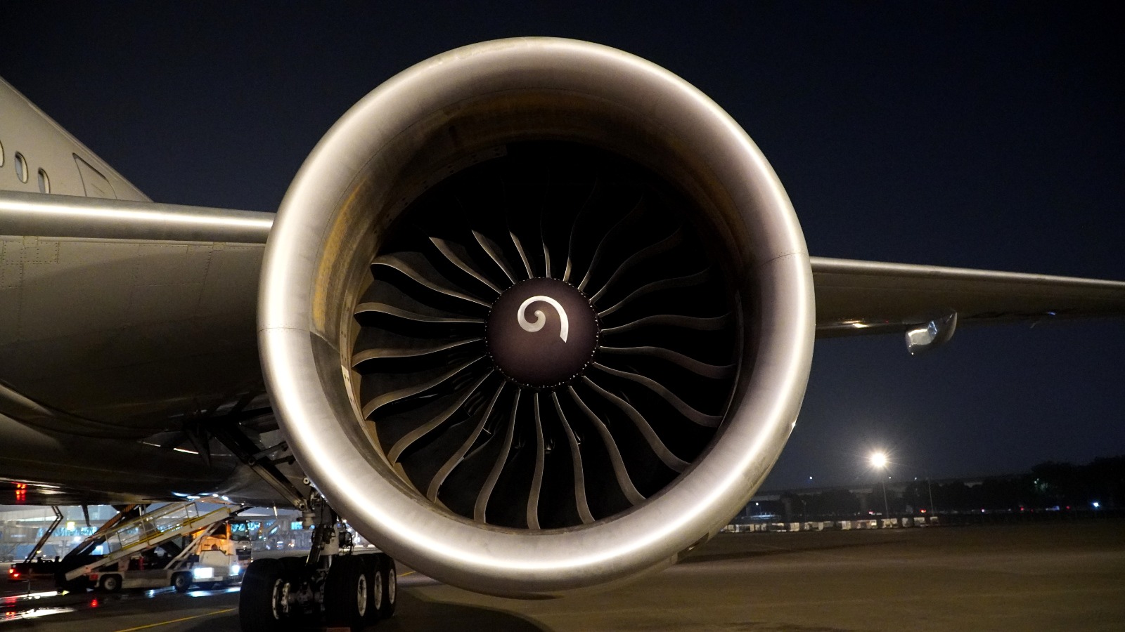 Close-up of an aircraft engine turbine during nighttime operations